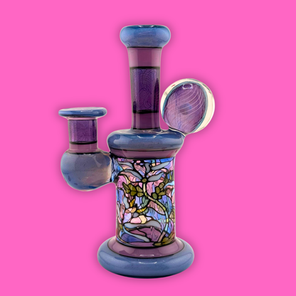 Windstar Glass X Sirpyro Glass Trapped Opal Meadow Scene 10mm 90 handcrafted glass piece on pink background.