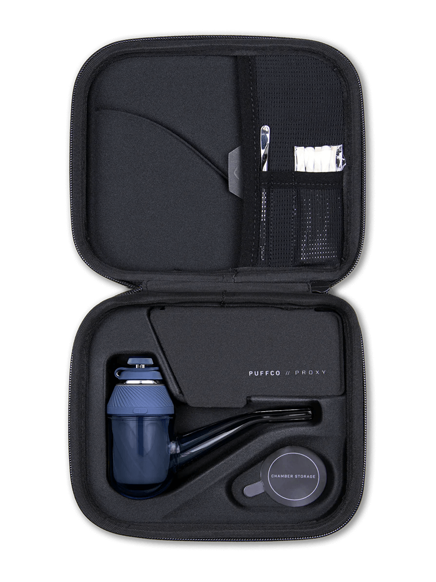 Puffco Proxy Kit open case showing vaporizer, joystick cap, and storage accessories in compact design.