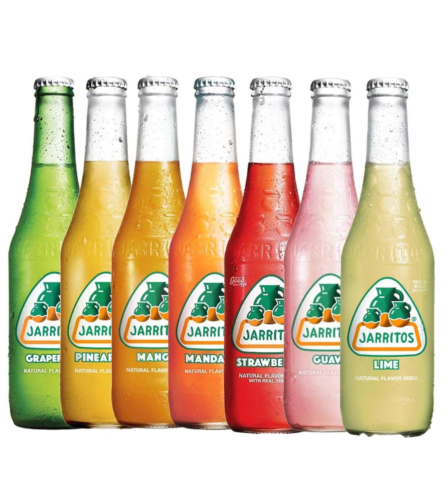 Variety of Jarritos Soda bottles showcasing tropical flavors like grape, pineapple, mango, and lime.