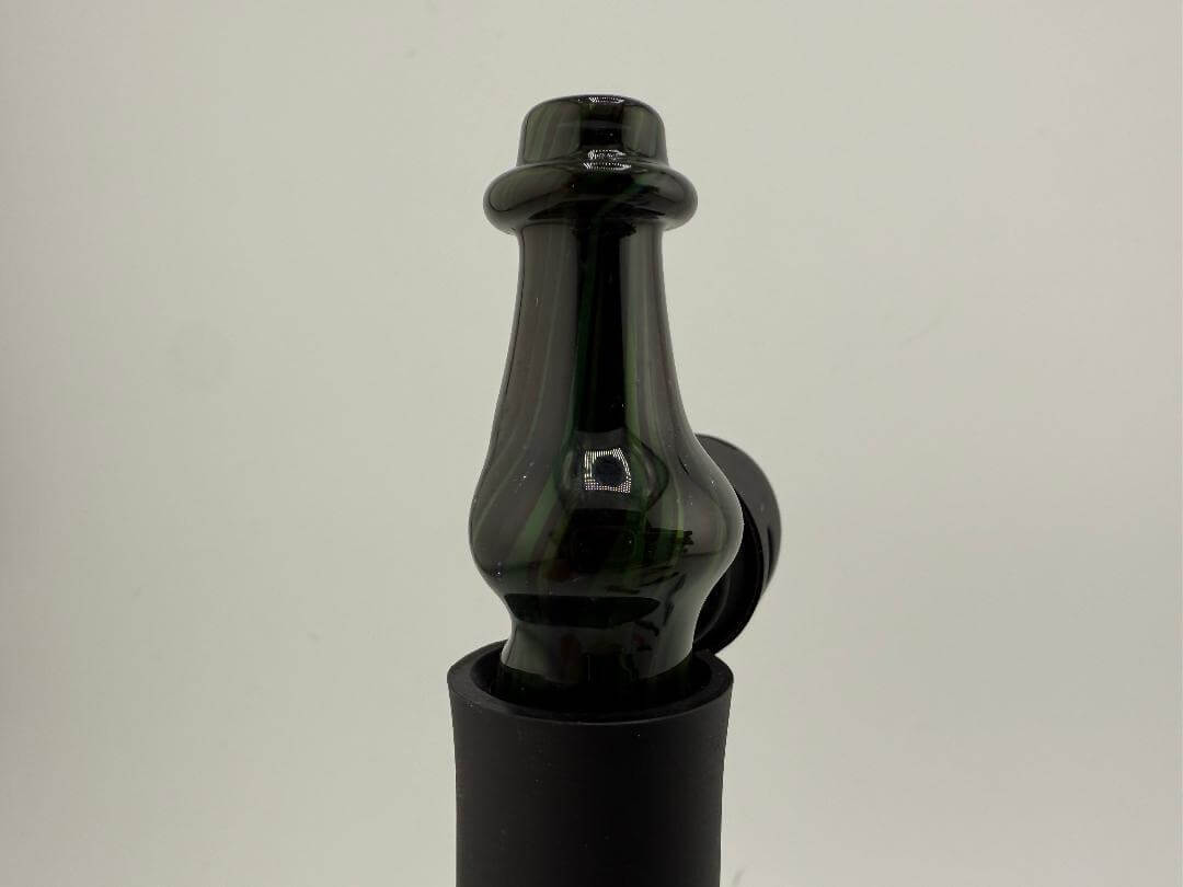 Brando Glass Pivot Top in rich brown and green colors, showcasing a unique artistic design for collectors and enthusiasts.