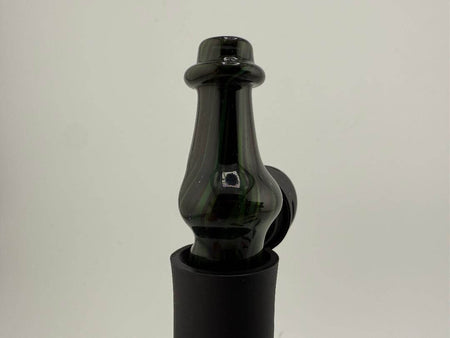 Brando Glass Pivot Top in rich brown and green colors, showcasing a unique artistic design for collectors and enthusiasts.