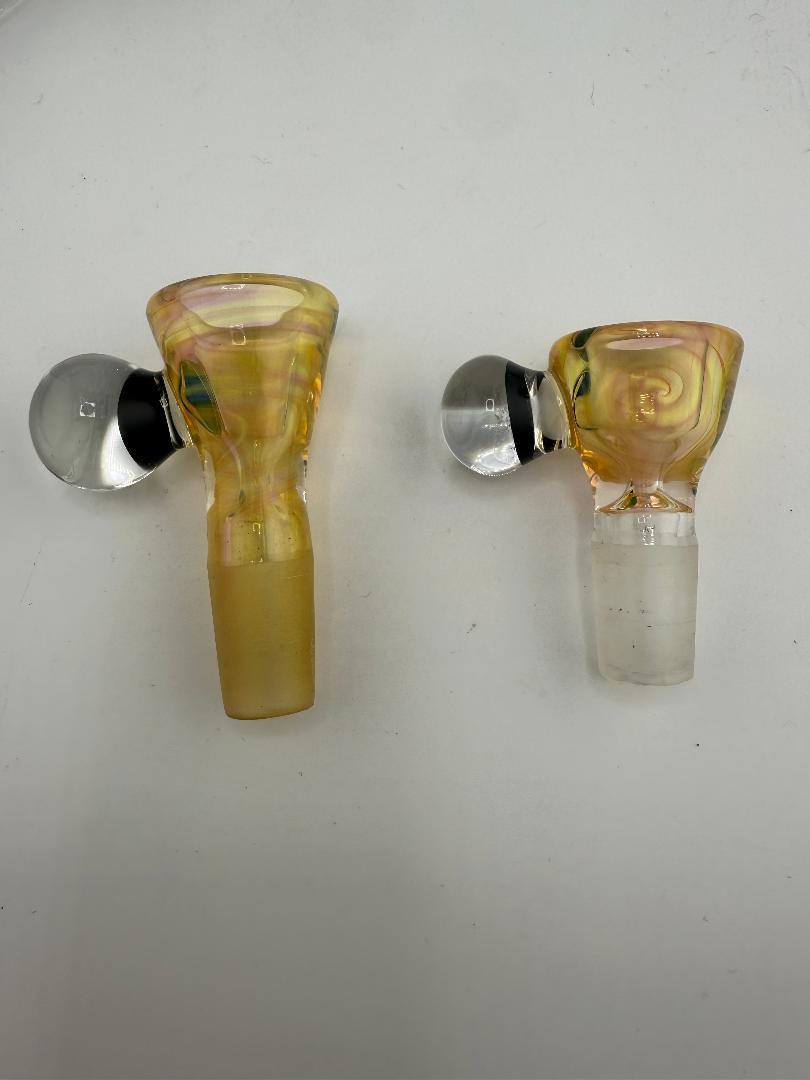 Two handcrafted Lylo Glass fumed 14mm bowls with colorful designs, showcasing Spokane craftsmanship and borosilicate glass durability.