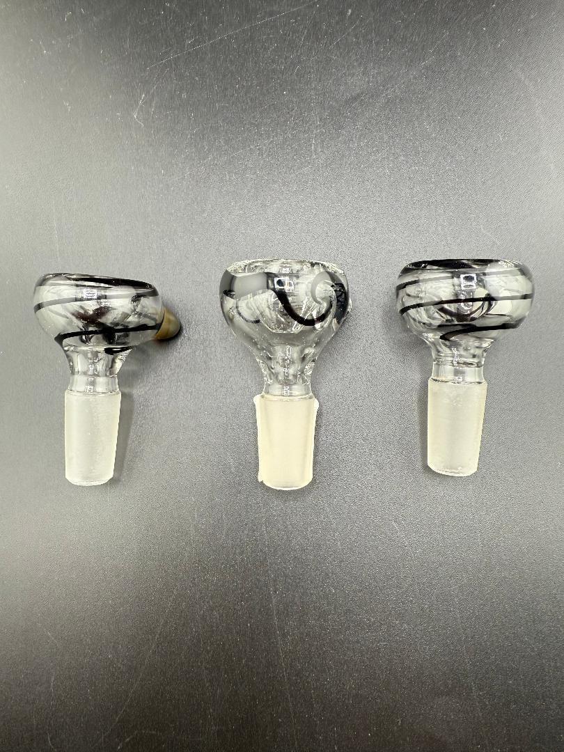 Three Filla John UV 14mm glass bowls with black and white swirl design on a gray surface.