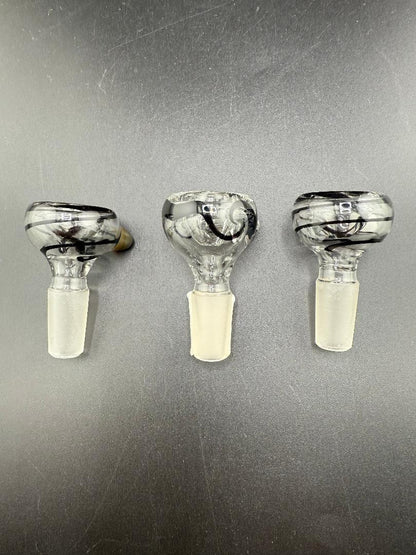 Three Filla John UV 14mm glass bowls with black and white swirl design on a gray surface.