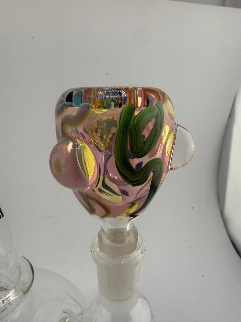 Colorful hand-blown glass bowl with vibrant swirls, featuring unique Scribble Tech design, fitting 14mm joint.