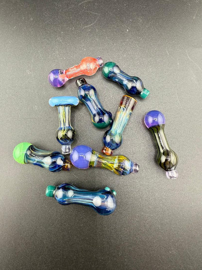 Colorful assortment of handcrafted glass accessories, including the Paulson Pieces Puffco Peak Pro Ball Cap Replacement.
