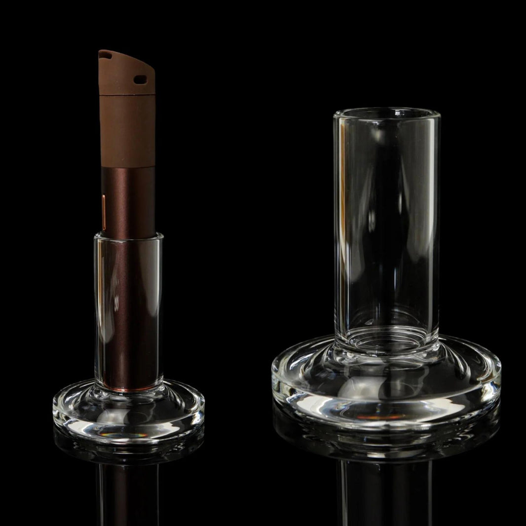 Tokr Glass Puffco Pivot Accessory - Pivot Stand displayed with Puffco device on a black background.
