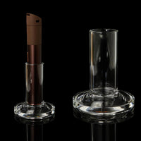 Tokr Glass Puffco Pivot Accessory - Pivot Stand displayed with Puffco device on a black background.