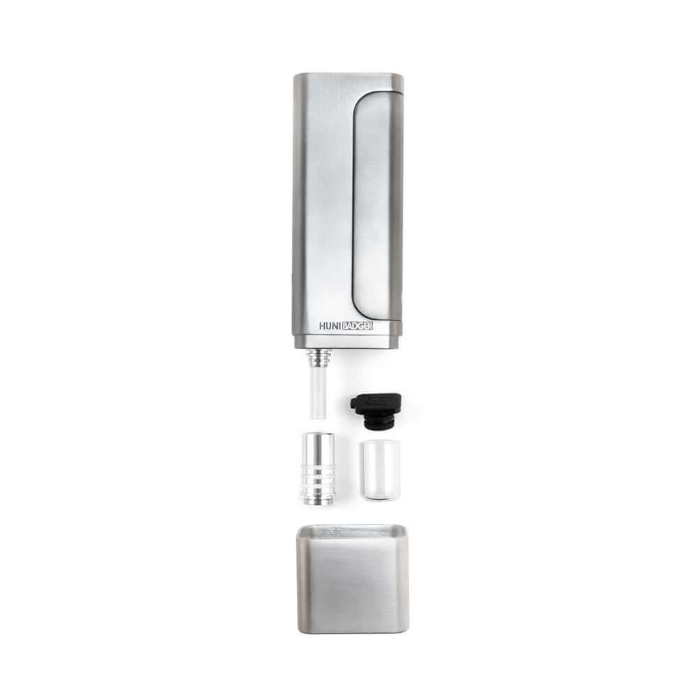 Huni Badger Portable Device Pro with accessories, showcasing sleek design and functionality for herbal extracts.