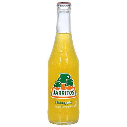 Jarritos Pineapple Soda 16oz bottle showcasing vibrant yellow color and authentic Mexican flavor.