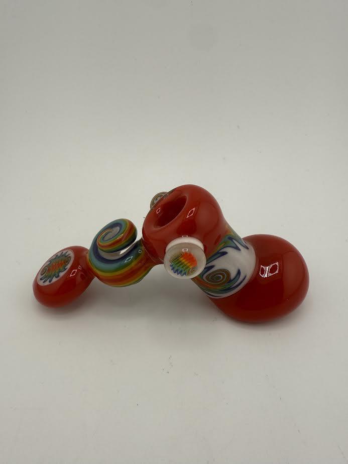 Colorful Mcdoogle Worked Hammer pipe in red with decorative swirls and patterns on the bowl.