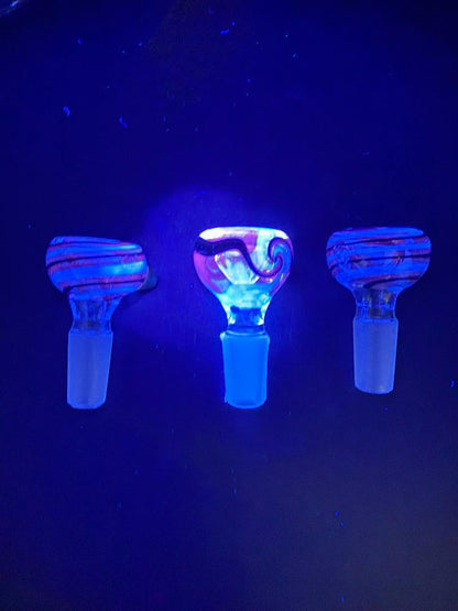 Filla John Black Light UV 14mm Bowl glowing under UV light, showcasing vibrant colors and unique designs.