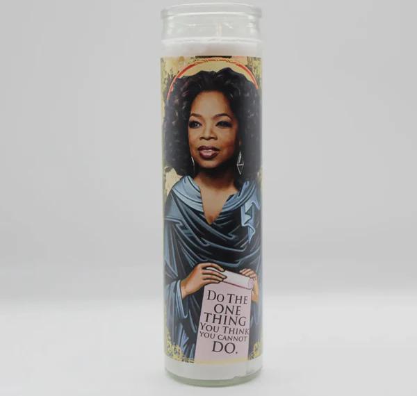 Bobbyk Saint Candles featuring a parody design of an inspiring figure with a motivational quote.
