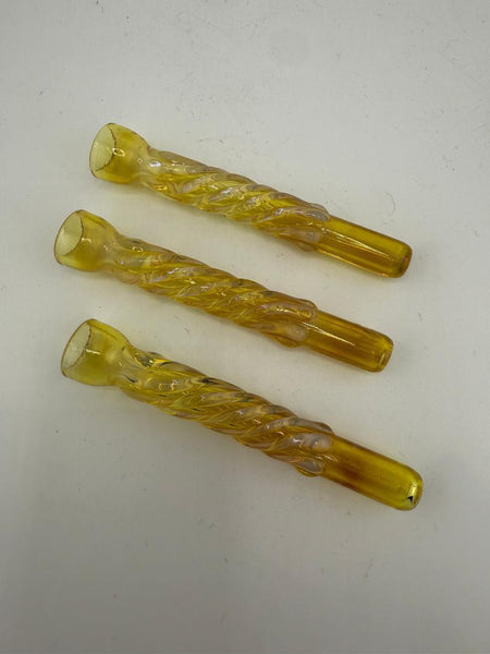 Three yellow handcrafted glass pinch hitter pipes for discreet smoking sessions.
