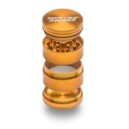 Santa Cruz Shredder 4-Piece Medium Grinder in gold, showcasing precision design for optimal herb grinding.