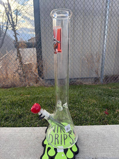AFM Glass 18" Beaker - Sports displayed on grass with vibrant colors and team logos.