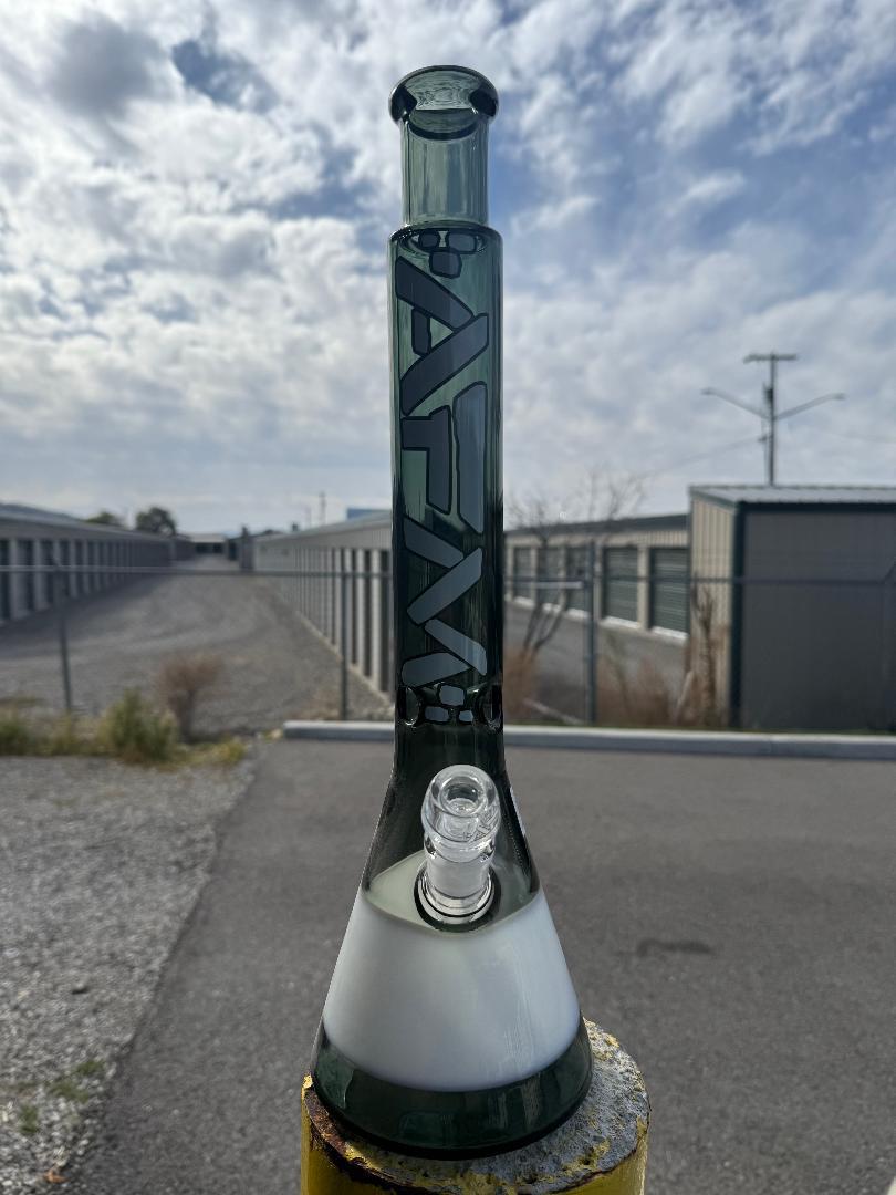 AFM Glass Quasar Beaker 14mm 45° smoke & White - Defect Beaker on display outdoors.