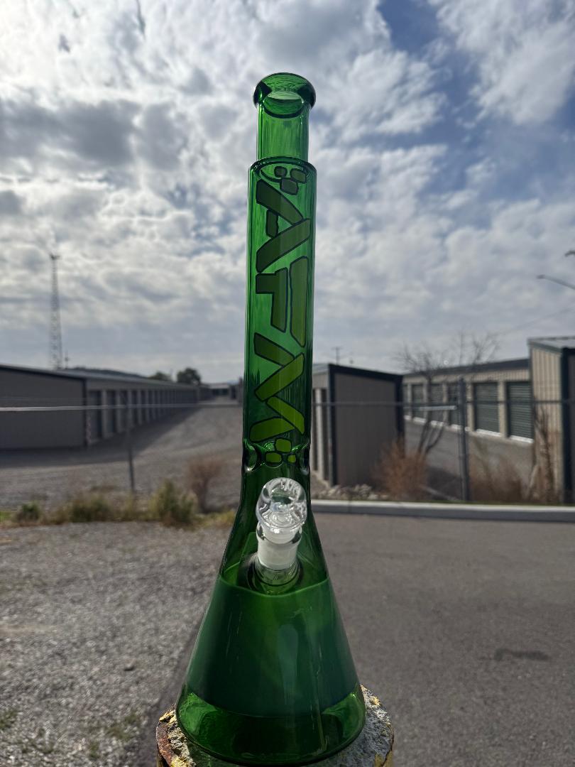 AFM Glass T430 2 Tone Green Flower Piece Beaker 14mm 90° showcasing vibrant green color and sleek design outdoors.