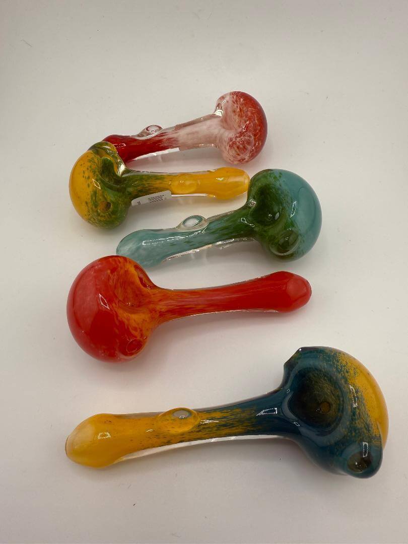 Annie Works Glass Frit Pipes in various colors showcasing intricate handmade designs.