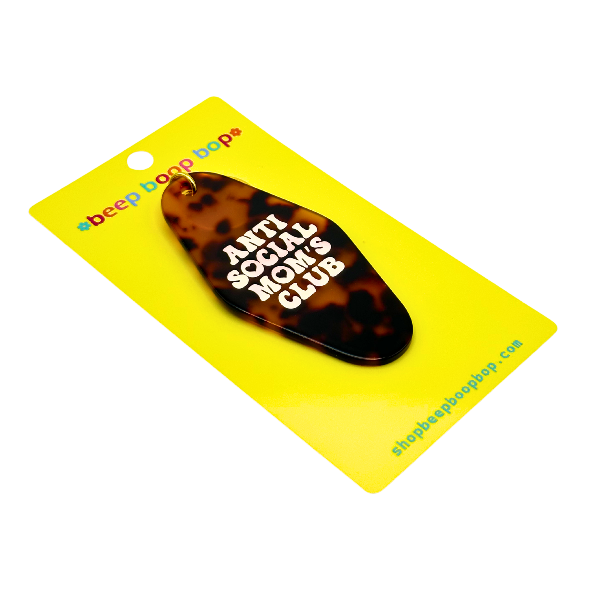 Anti Social Mom's Club | Keychain on a yellow backing, featuring a stylish tortoiseshell design.