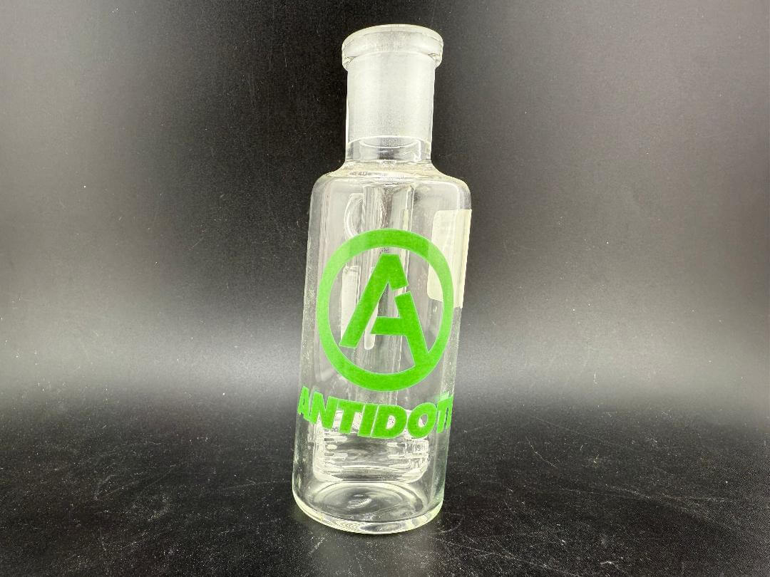 Antidote Glass 14mm 90° Ash Catcher with logo on transparent borosilicate glass design.