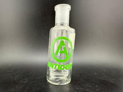 Antidote Glass 14mm 90° Ash Catcher with logo on transparent borosilicate glass design.