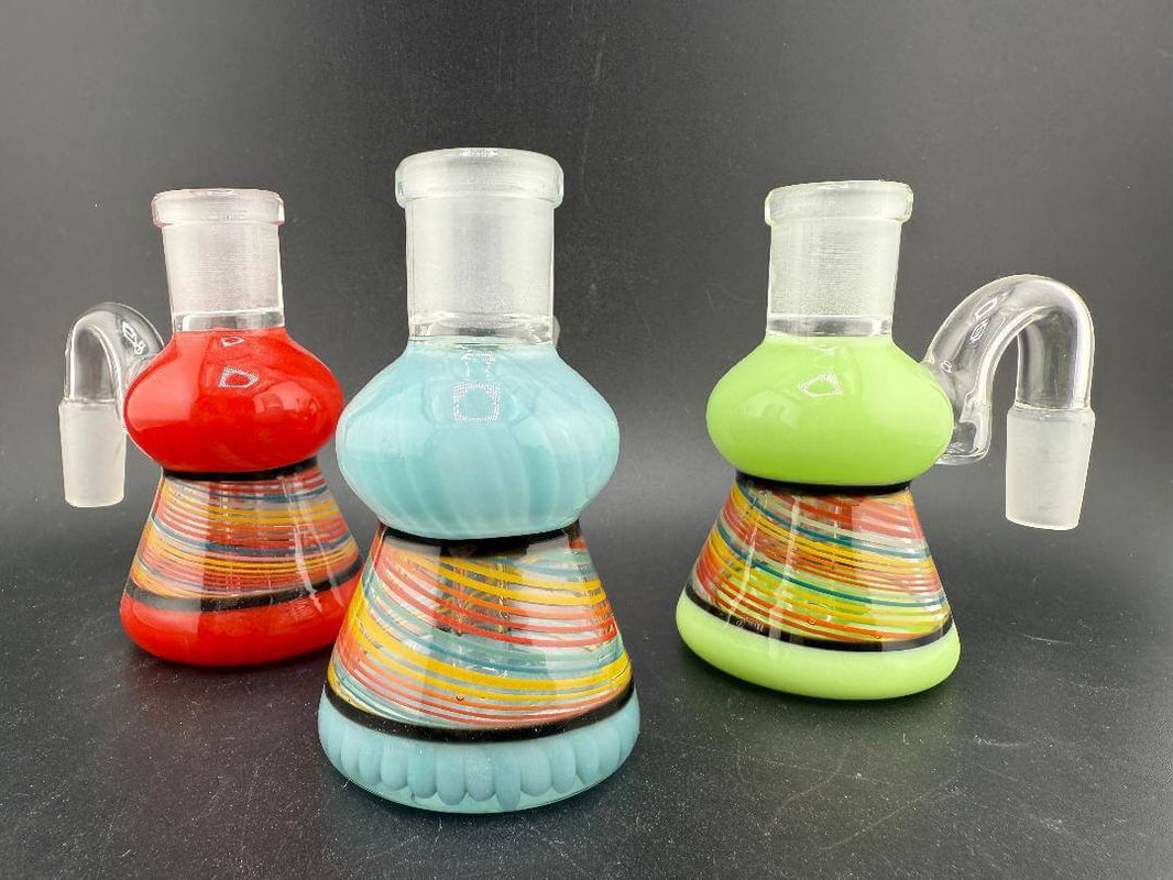 Antidote Glass14mm 90° Retti Line Worked Ash Catcher in red, blue, and green with vibrant line work pattern.