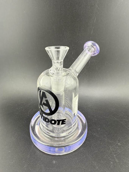 Antidote Glass Capsule Rig 14mm 90° in transparent design with purple accents and logo detail.