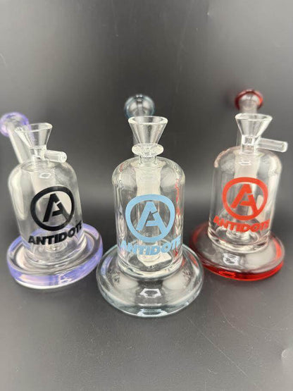 Antidote Glass Capsule Rig 14mm 90° available in Purple, Blue, and Red with sleek design and high performance.