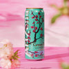 Arizona Iced Tea 16oz can featuring Green Tea with Ginseng and Honey, colorful floral design on a pink backdrop.