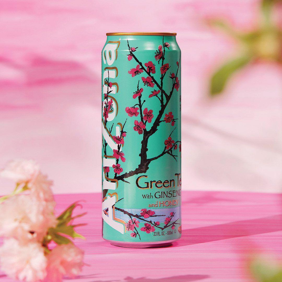 Arizona Iced Tea 16oz can featuring Green Tea with Ginseng and Honey, colorful floral design on a pink backdrop.