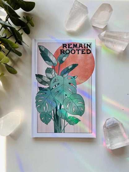 Ark Made Remain Rooted Lined Journal featuring a plant design and colorful background, perfect for mindful writing and planning.