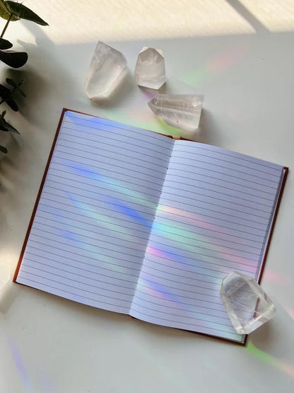 Ark Made The Self Lined Journal open with lined pages and crystal decor on a bright surface.
