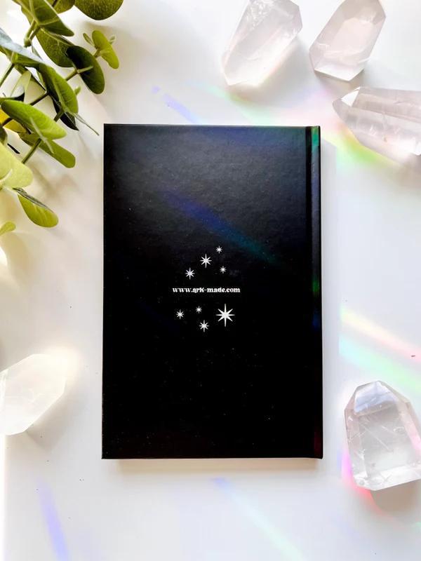 Ark Made The Self Lined Journal displayed among crystals and greenery on a light background.