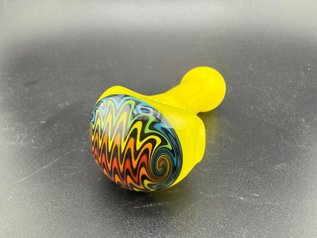 Vibrant Mcdoogle Glass Mini Wig Wag Pipe with bold yellow base and colorful spiraled design, handcrafted in Spokane, WA.