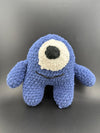 Crochet one-eyed monster plush toy, soft blue texture with a round eye and smiling mouth, perfect for kids.