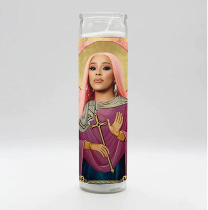 Bobbyk Saint Candles featuring a tall white prayer candle with a pop culture icon design.