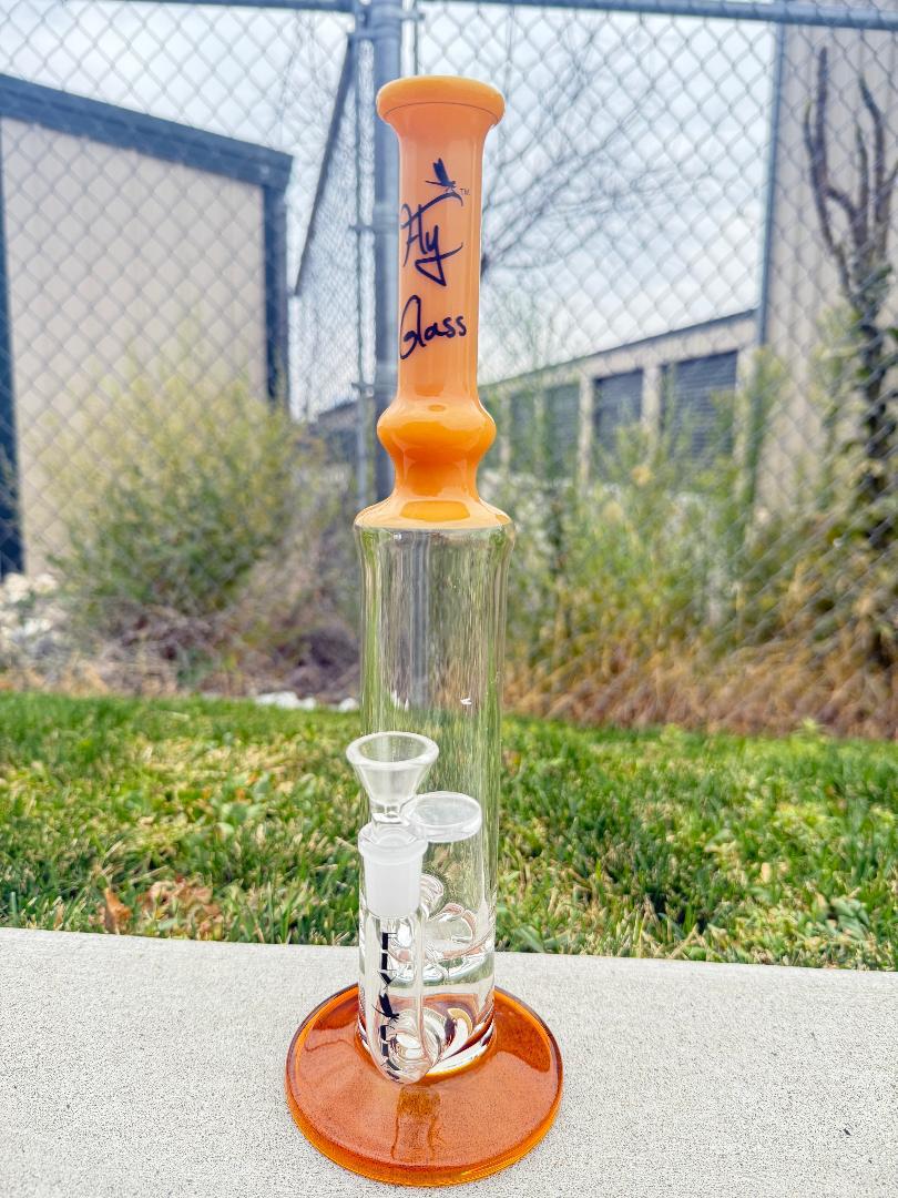 Fly Glass Straight Tube 14mm 90°, clear design with orange accents, perfect for smooth, clean hits and durable performance.