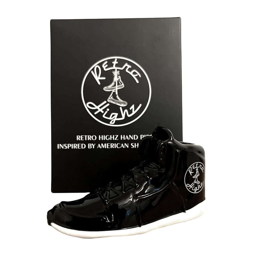 Retro Highz black hand pipe designed like a basketball shoe, inspired by American style, presented in stylish packaging.