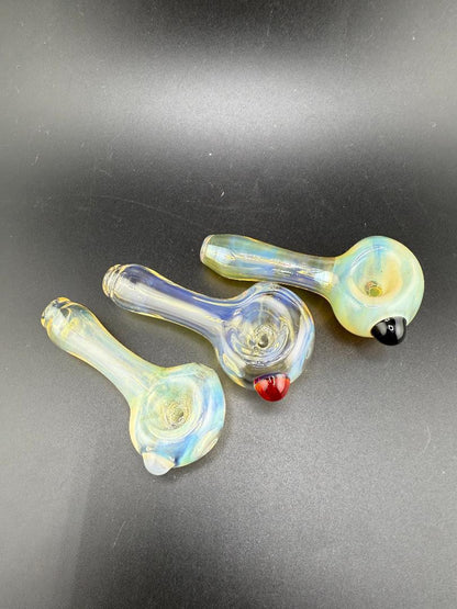 Highgrade Glass Simple Fumed Hand Pipes in various colors, showcasing hand-blown craftsmanship and a unique fumed finish.