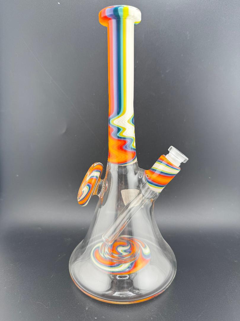 Filla John Glass Circus Beaker 10mm 45° with rainbow colors, durable design for smooth hits.