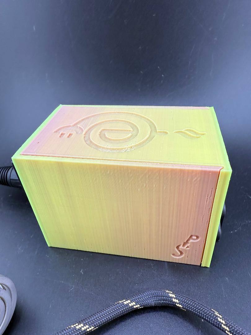 3D printed Budget Enail by Disorderly Conduction, featuring a colorful spiral design and compact shape.