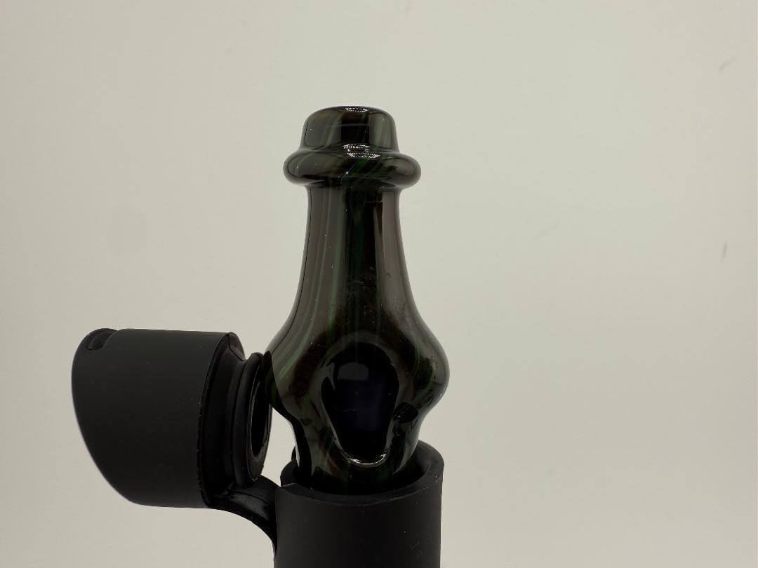 Brando Glass Pivot Top in brown and green color, showcasing the sleek design and unique shape for optimal use.