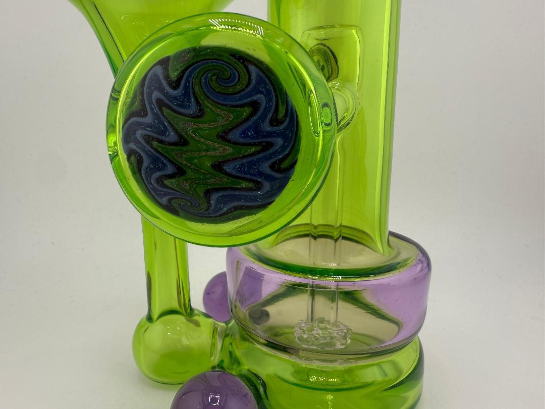 Crondo Glass Green & Purple RBR Shaped Recycler with unique design and 14mm joint for flavorful, smooth hits.