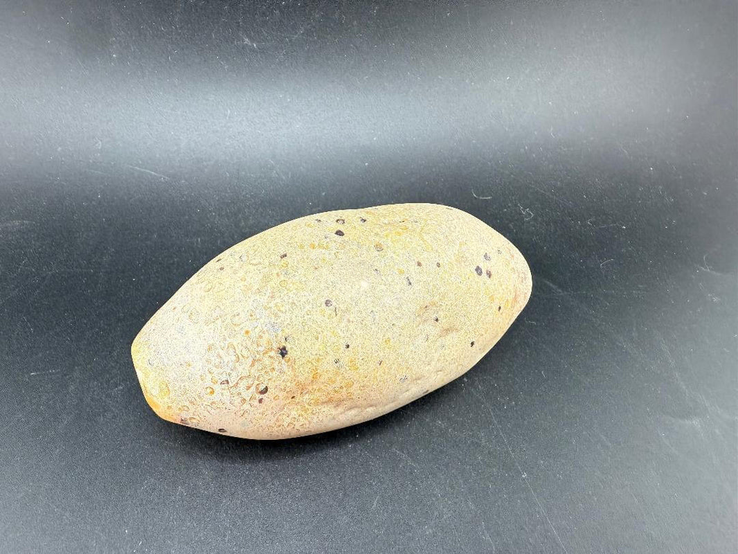 Berning Glass Novelty Pipe - Speckled Rock Pipe resembling a natural speckled stone on a black background.