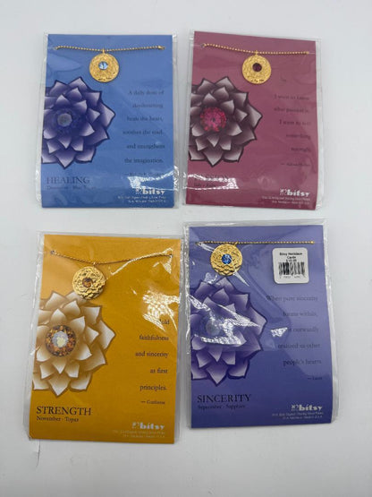 Bitsy Gemstone Birth Month Necklace displayed with four options: Healing, Strength, Sincerity, and corresponding colors.