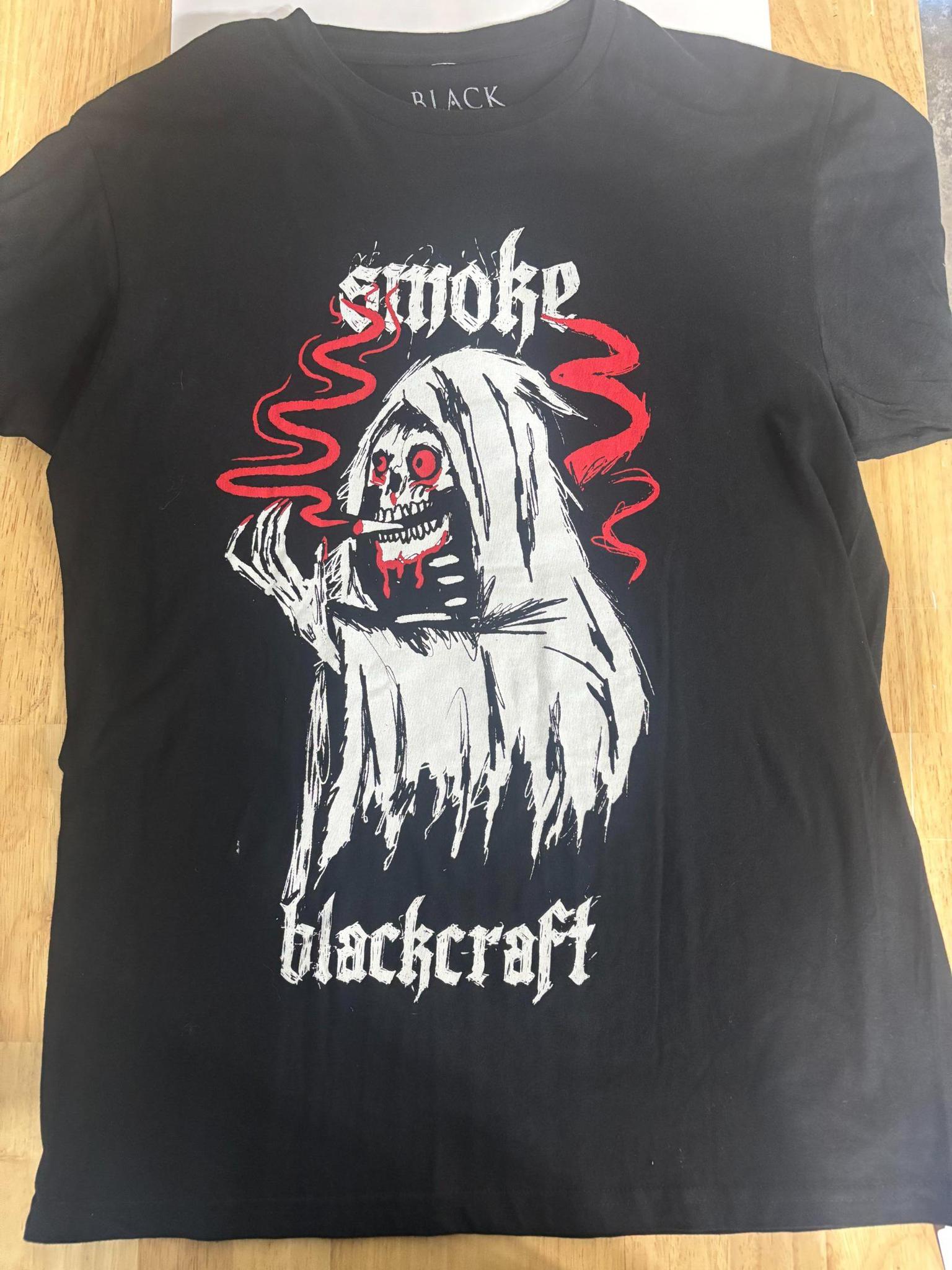 BlackCraft Cult T-shirt featuring an occult graphic with a ghost design and red smoke accents.