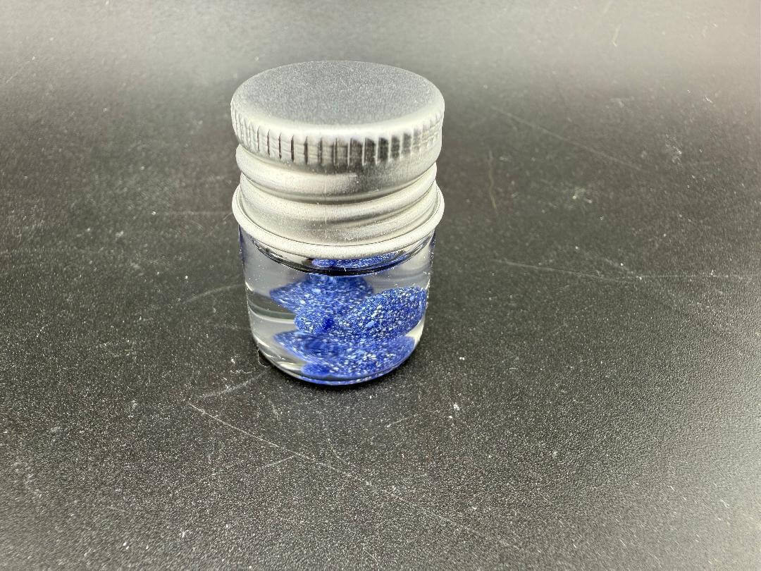 Lucky Gnome Glass Terp Pearl - Boxing glove in a jar with blue contents for enhancing dabbing experience.