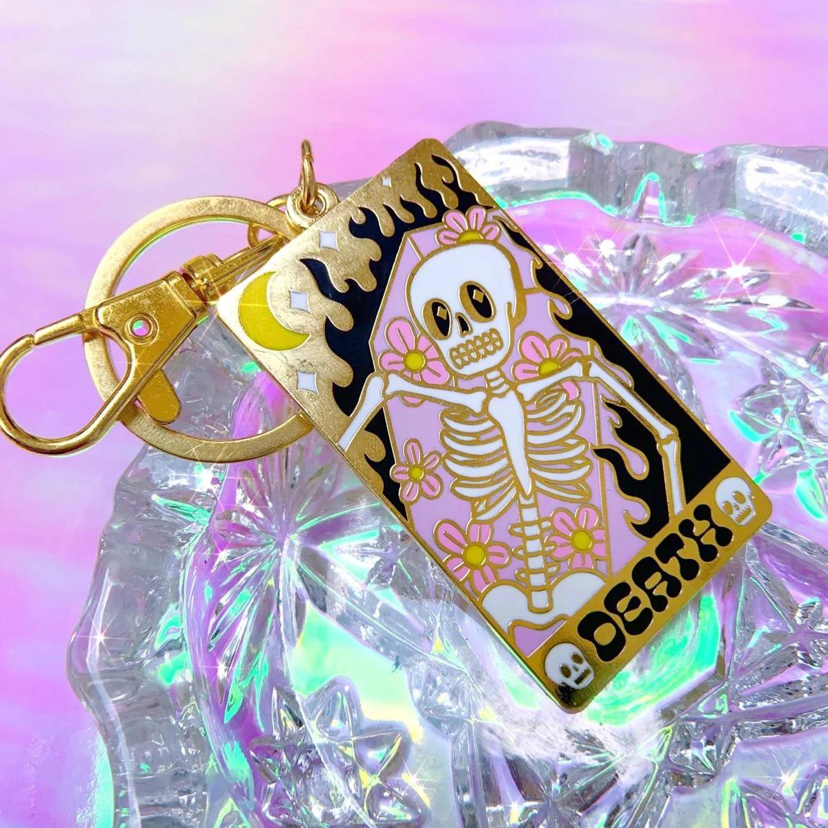 Bobby Pins Co. Keychain - Death Tarot Card featuring a colorful skeleton and floral design.
