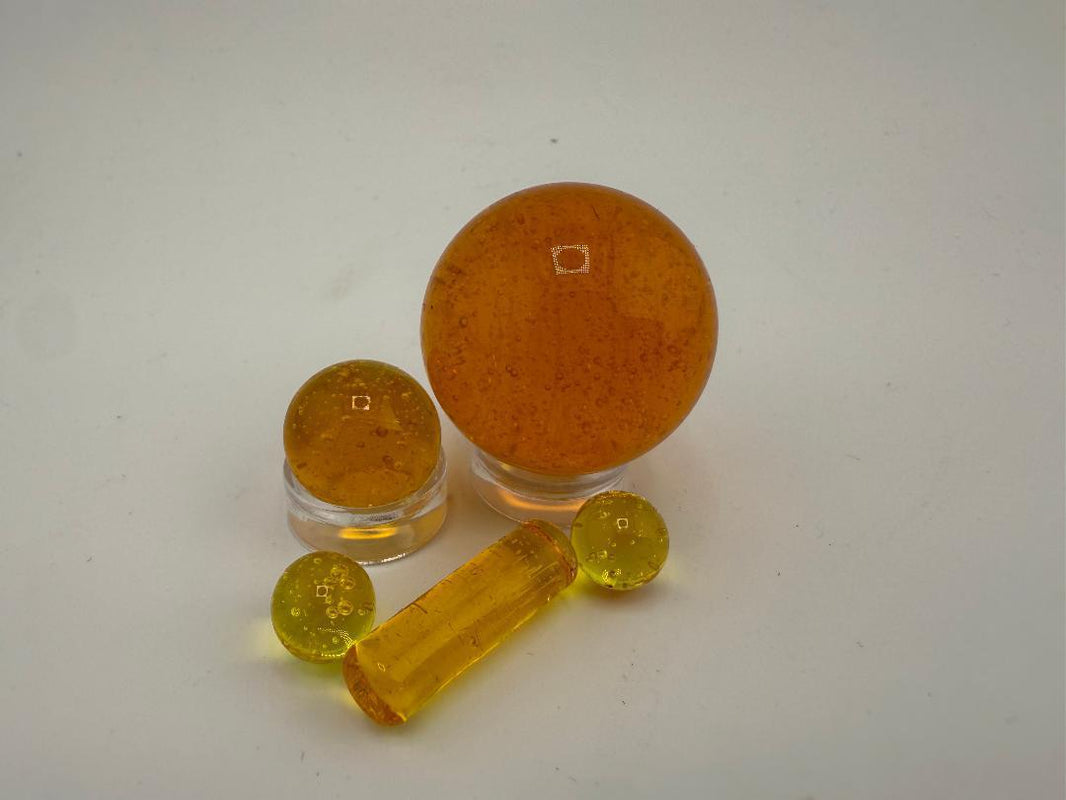 Bowman Glass Oversized Terp Slurper Marble Set - 4pc in amber color, crafted from American borosilicate glass.